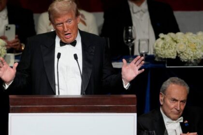 Republican presidential nominee former President Donald Trump speaks as Senate Majority Leader Chuck Schumer of N.Y., listens at the 79th annual Alfred E. Smith Memorial Foundation Dinner, Thursday, Oct. 17, 2024, in New York.