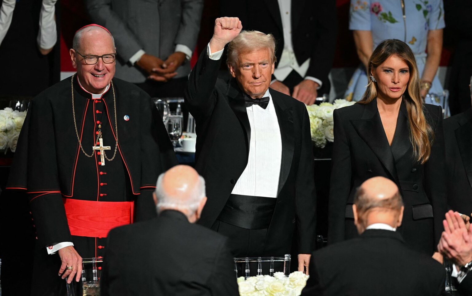 PHOTO: Former President and Republican presidential candidate Donald Trump with his wife Melania Trump and Archbishop of New York Timothy M. Dolan (L) attend the 79th Annual Alfred E. Smith Memorial Foundation Dinner in New York, Oct. 17, 2024.