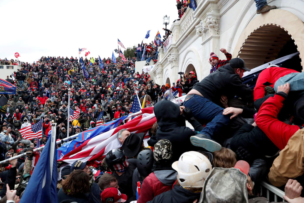 Rioters breach the U.S. Capitol in 2021.