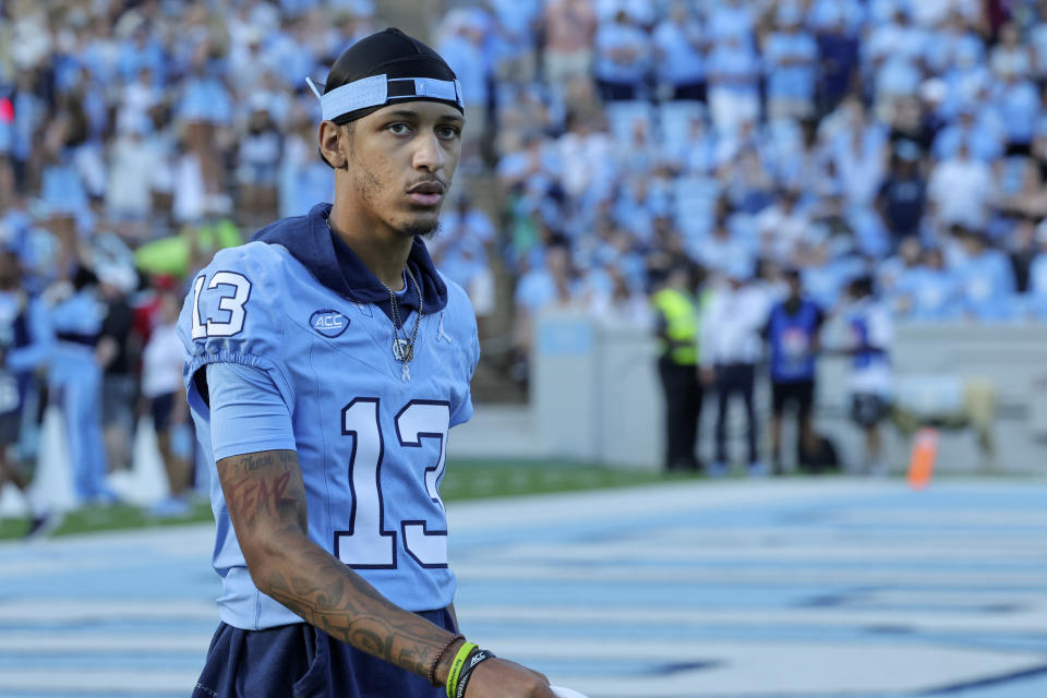 FILE - North Carolina wide receiver Tylee Craft (13) walks the bench during the second half of an NCAA college football game against Minnesota, Sept. 16, 2023, in Chapel Hill, N.C. (AP Photo/Reinhold Matay, File)