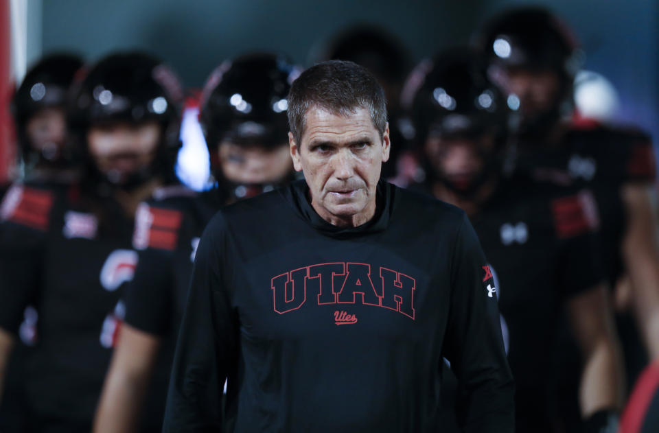 SALT LAKE CITY, UT - SEPTEMBER 28: Andy Ludwig offensive coodinator and quarterbacks coach of the Utah Utes leads his quarterbacks onto the field before their game against the Arizona Wildcats at Rice Eccles Stadium on September 28, 2024 in Salt Lake City, Utah. (Photo by Chris Gardner/Getty Images)