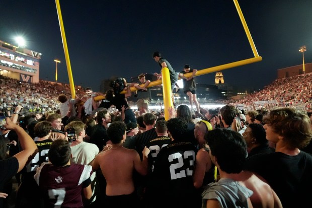 Vanderbilt fans tear down the goal post the after team's 40-35 victory against No. 1 Alabama on Oct. 5, 2024, in Nashville, Tenn. (George Walker IV/AP)