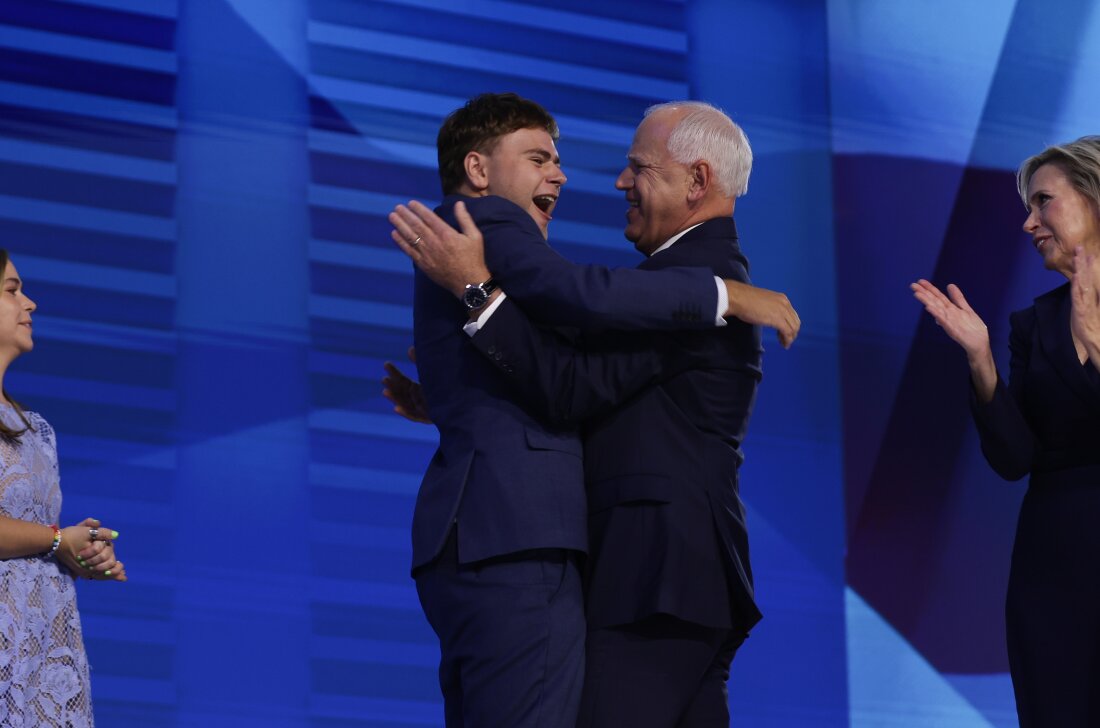 Tim Walz celebrates with his son Gus Walz at the Democratic National Convention.