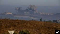 Smoke rises following Israeli bombardment in southern Lebanon as seen from northern Israel, Oct. 6, 2024.