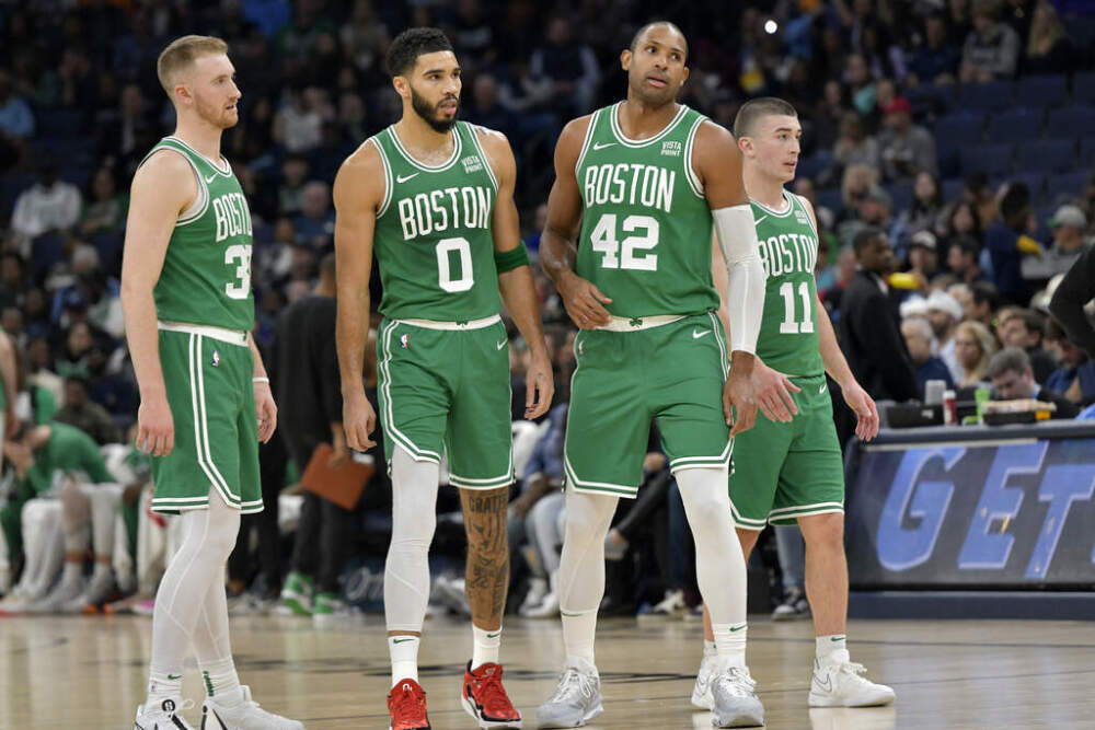 Boston Celtics players (from left) Sam Hauser, Jayson Tatum, Al Horford, and Payton Pritchard. (Brandon Dill/AP)