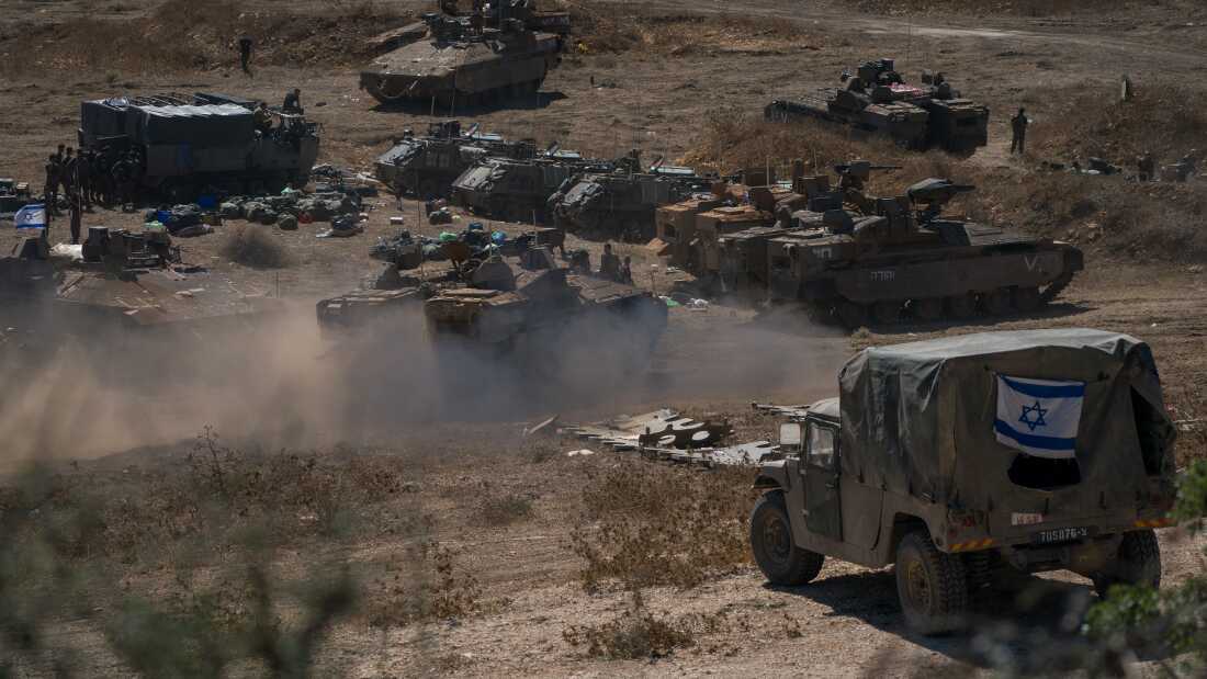 Tanks and troops gather in northern Israel on Monday in preparation for a ground invasion.