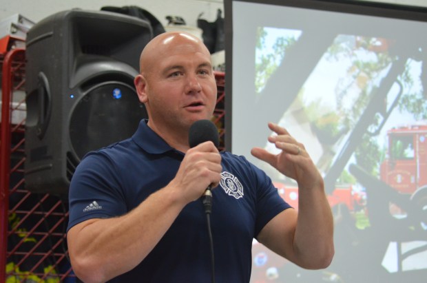 Oak Forest firefighter/paramedic and Project Fire Buddies Executive Director Kurt DeGroot speaks Oct. 20, 2024, at the watch party for Reyna Arreguin. (Jeff Vorva/for the Daily Southtown)