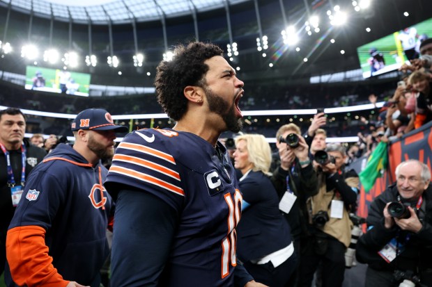 Chicago Bears quarterback Caleb Williams (18) celebrates as he heads to the locker room after a victory over the Jacksonville Jaguars at Tottenham Hotspur Stadium in London on Oct. 13, 2024. (Chris Sweda/Chicago Tribune)